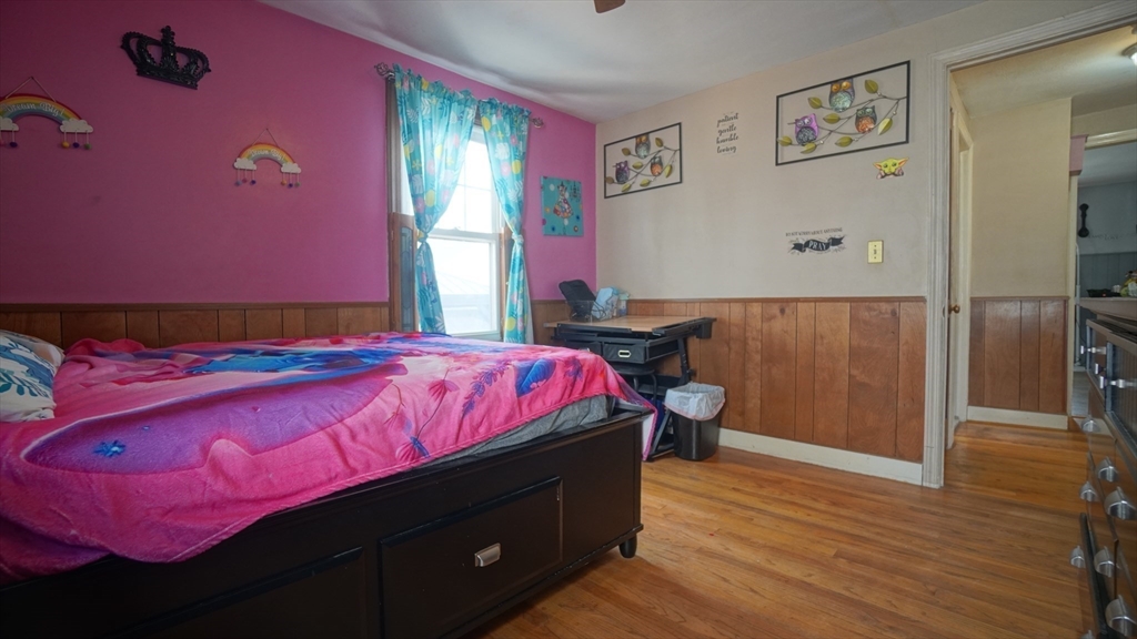 41 Parallel Street Springfield, MA 01104 - Photo 23 of 35 a spacious bedroom with a bed and a window