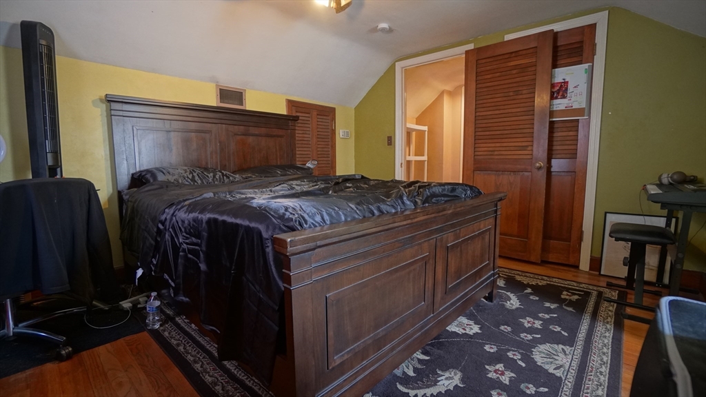 41 Parallel Street Springfield, MA 01104 - Photo 26 of 35 a bed sitting in a bedroom next to a window