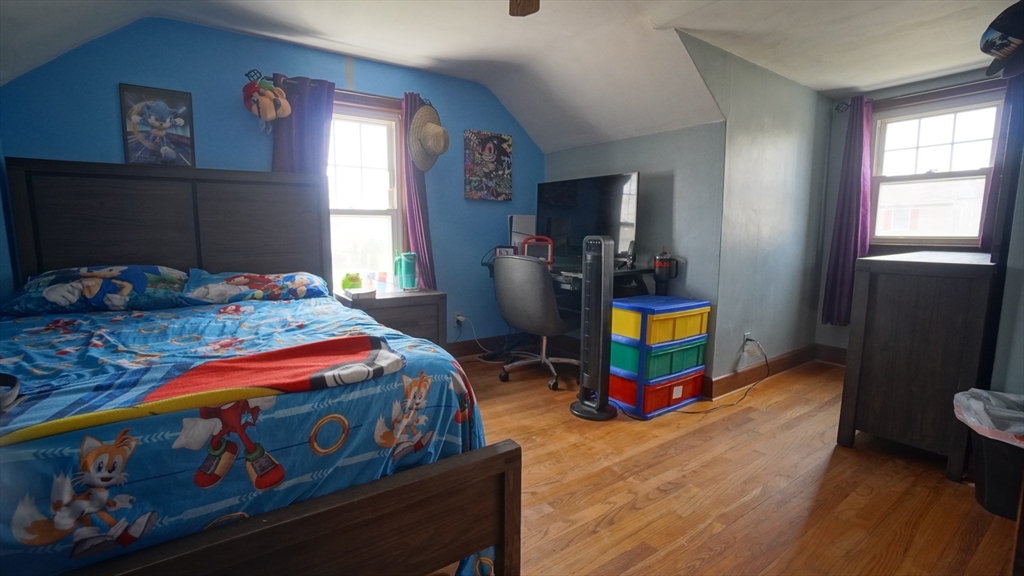 41 Parallel Street Springfield, MA 01104 - Photo 29 of 35 a bedroom with a bed a window and dresser