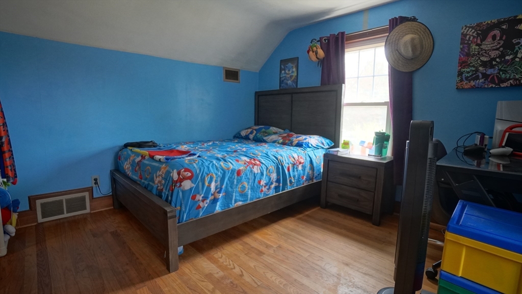 41 Parallel Street Springfield, MA 01104 - Photo 30 of 35 a bedroom with a bed and a window