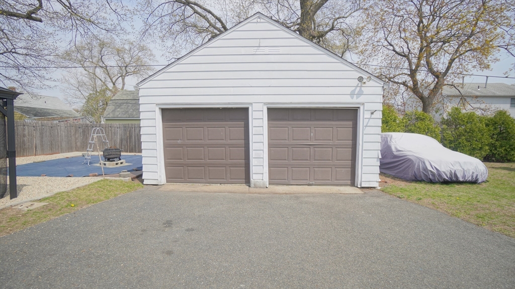 41 Parallel Street Springfield, MA 01104 - Photo 8 of 35 a view of a house with a yard and garage