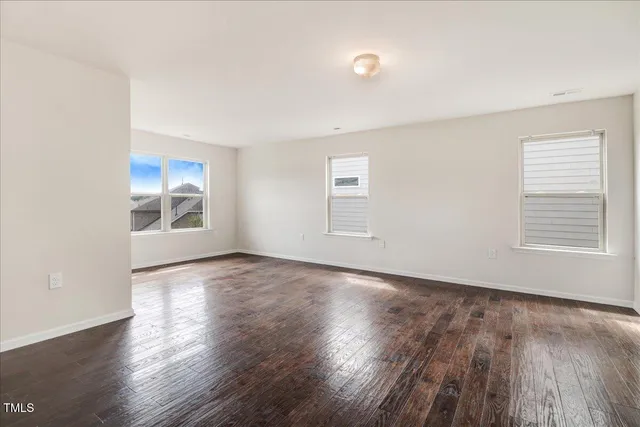 a kitchen with kitchen island granite countertop a table and chairs in it