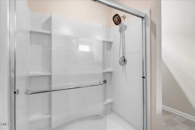 a bathroom with double sink and a mirror