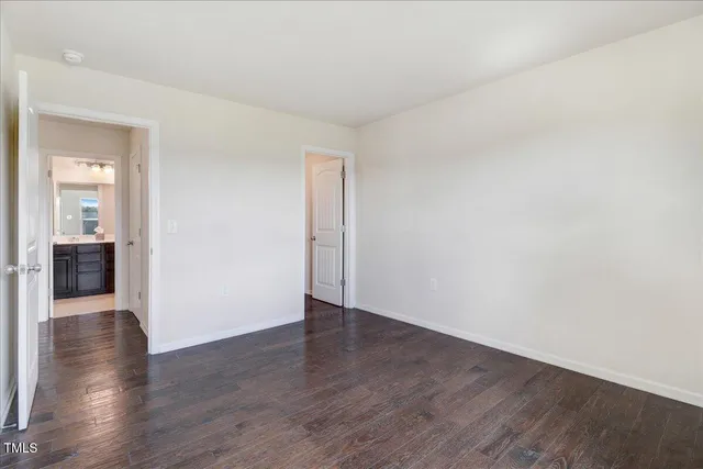 an empty room with windows and window