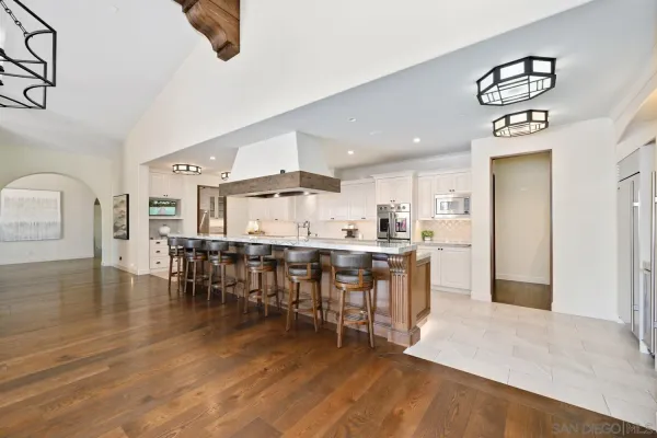 a kitchen with stainless steel appliances granite countertop a sink and cabinets