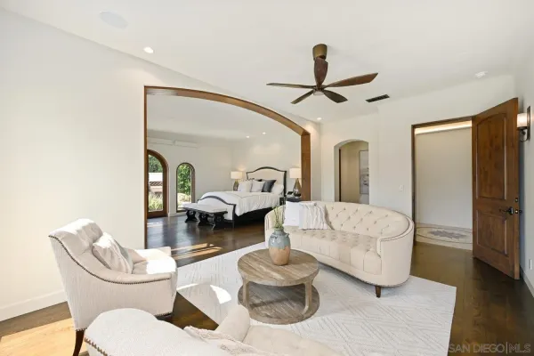 a bed room with a bed and a mirror