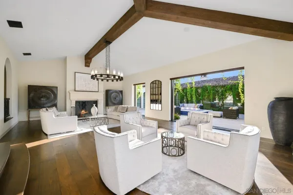 a large kitchen with a table and chairs