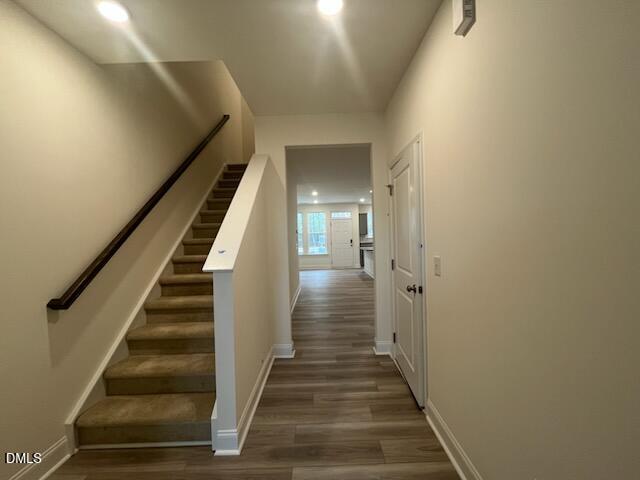 6431 Granite Quarry Drive Raleigh, NC 27610 - Photo 18 of 59 a view of staircase with wooden floor and white walls