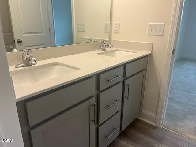 6431 Granite Quarry Drive Raleigh, NC 27610 - Photo 32 of 59 a bathroom with a sink and a mirror