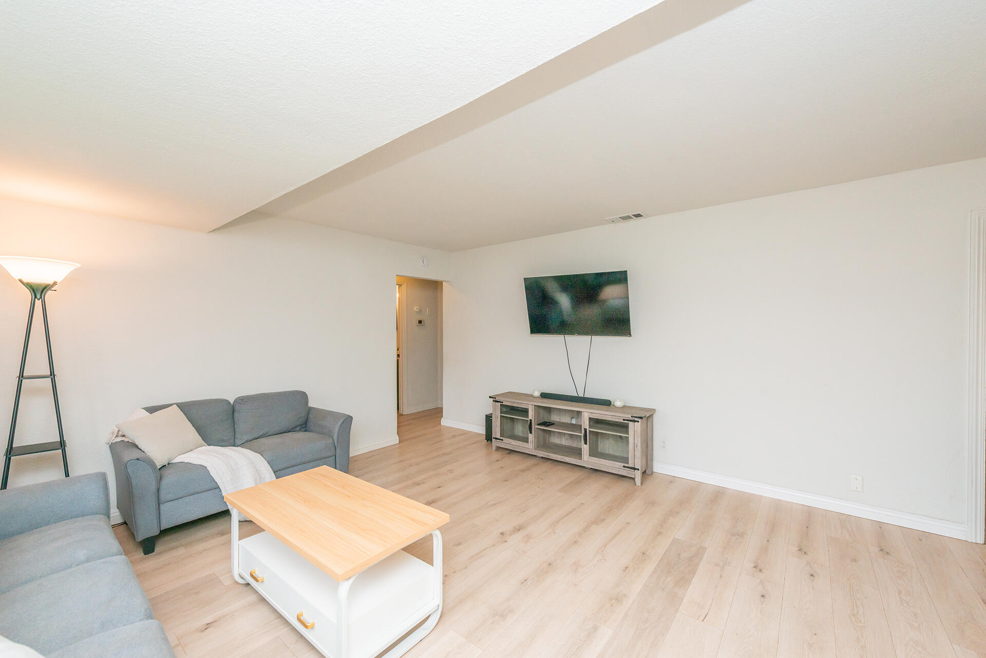 1115 2nd Street Redding, CA 96002 - Photo 11 of 39 a living room with furniture and a wooden floor