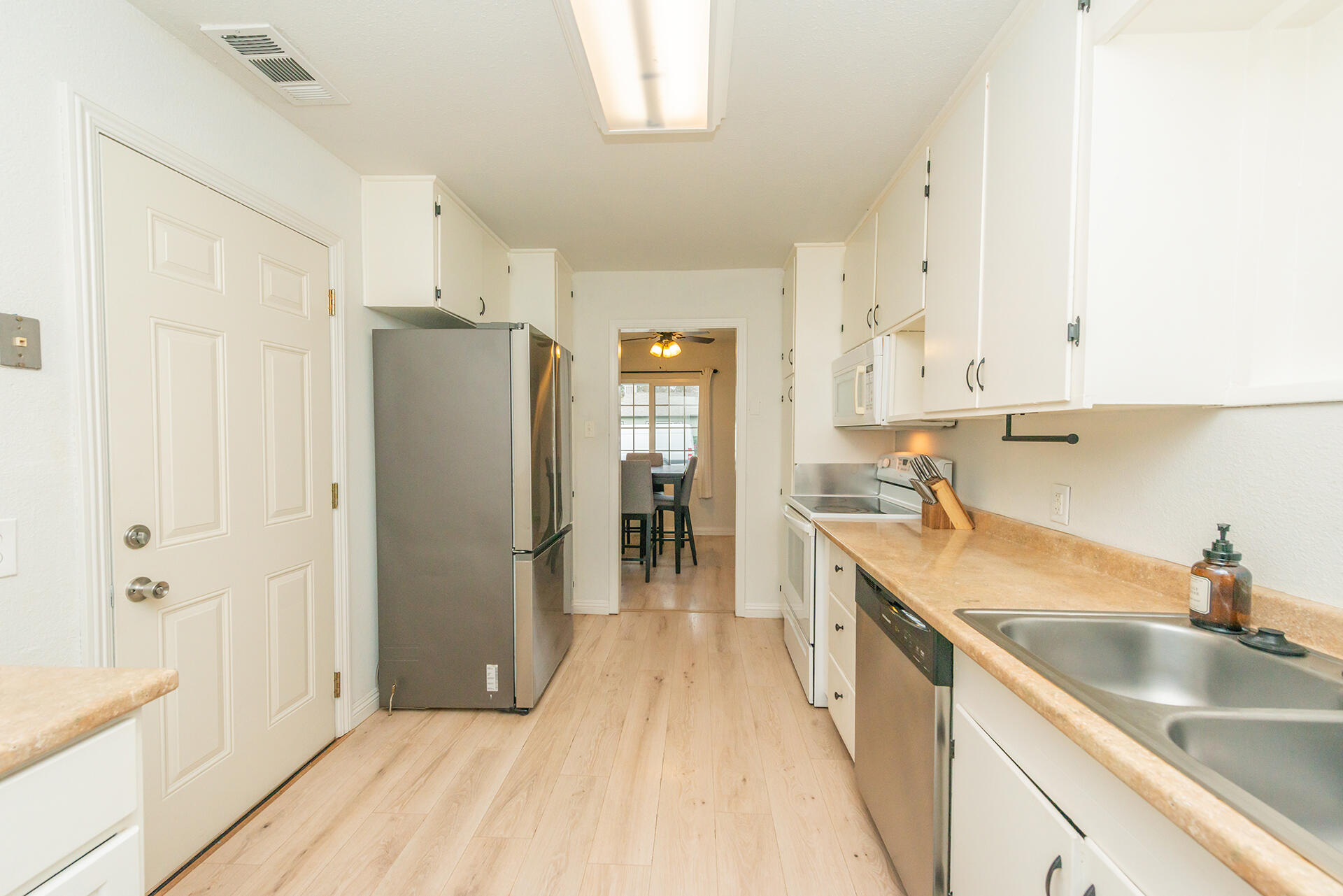 1115 2nd Street Redding, CA 96002 - Photo 20 of 39 a kitchen with stainless steel appliances granite countertop a refrigerator and a sink