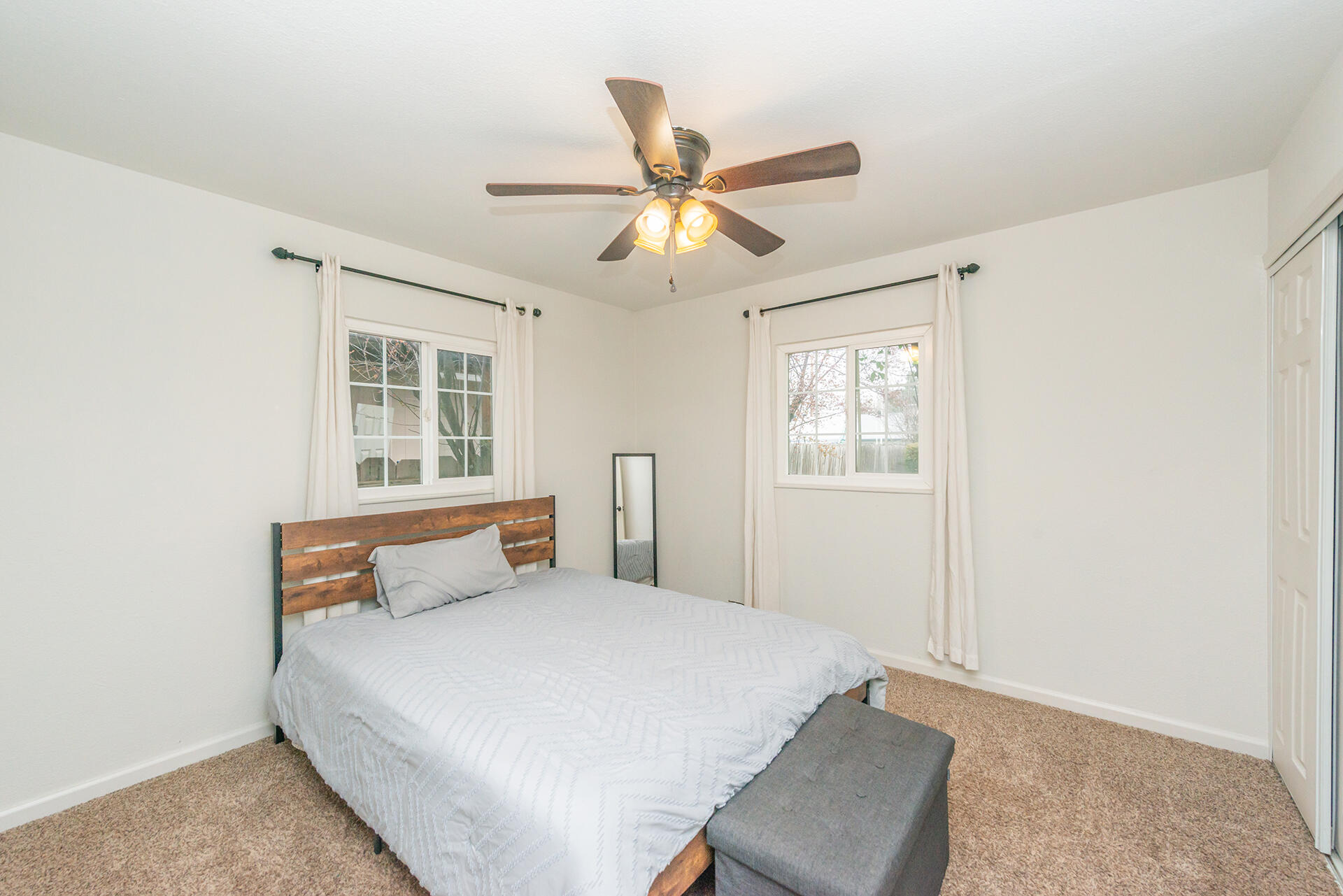 1115 2nd Street Redding, CA 96002 - Photo 26 of 39 a bedroom with a bed and window
