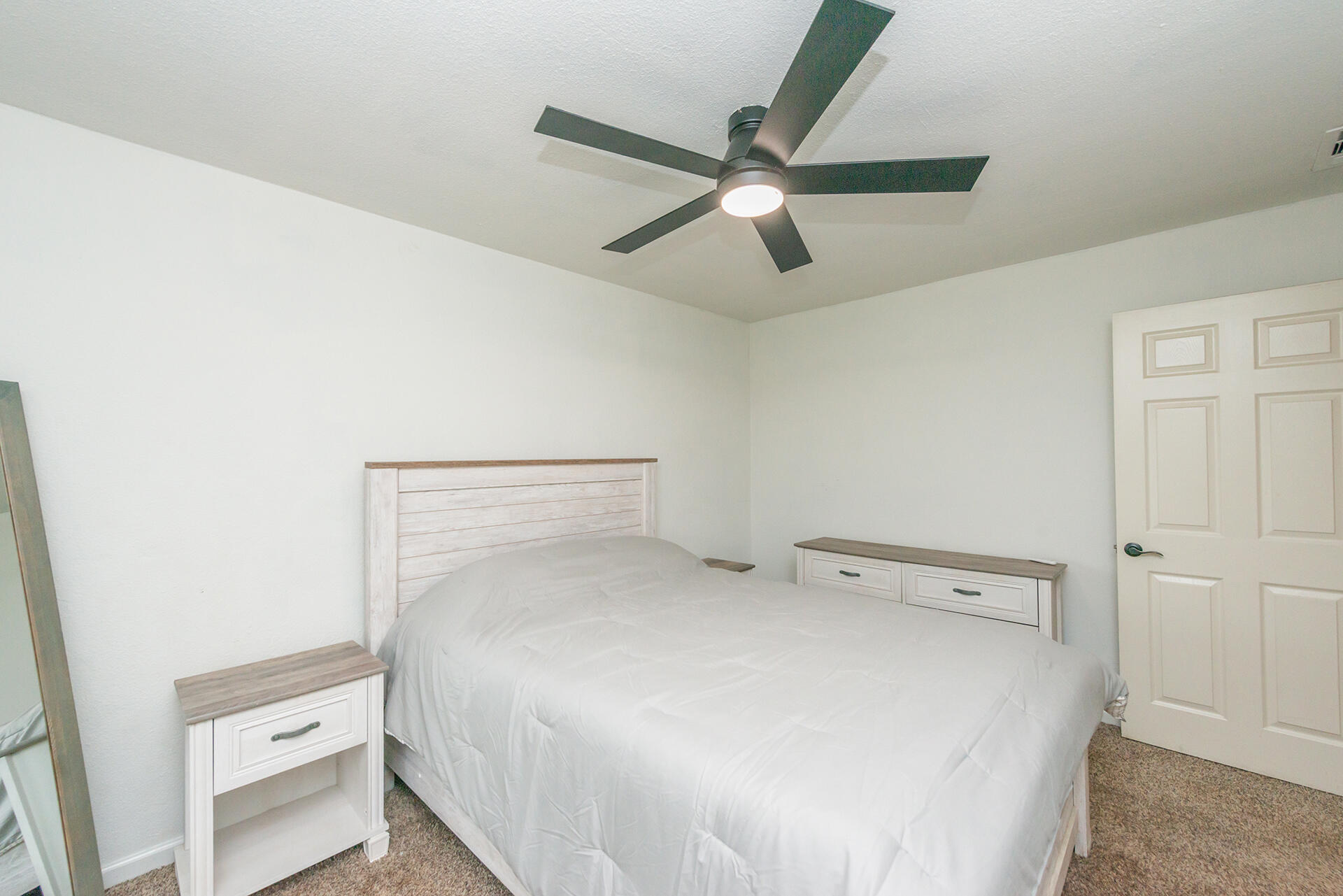 1115 2nd Street Redding, CA 96002 - Photo 30 of 39 a bed room with a bed and a ceiling fan