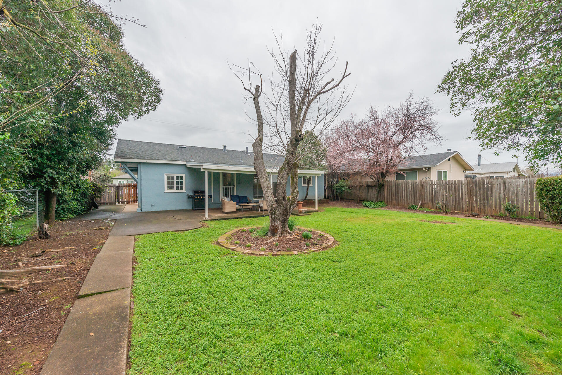 1115 2nd Street Redding, CA 96002 - Photo 35 of 39 a front view of a house with a yard