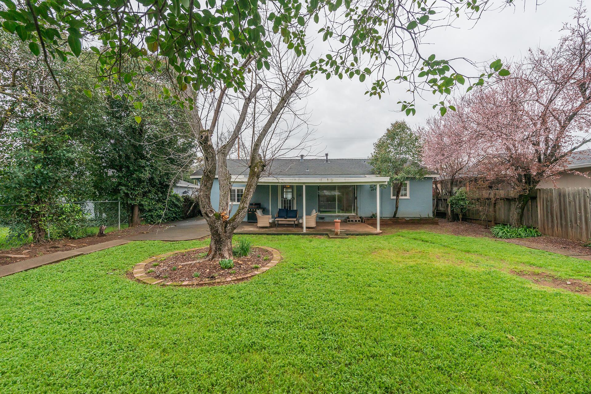 1115 2nd Street Redding, CA 96002 - Photo 37 of 39 a front view of a house with garden