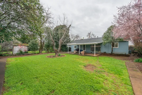 a front view of house with yard and seating area