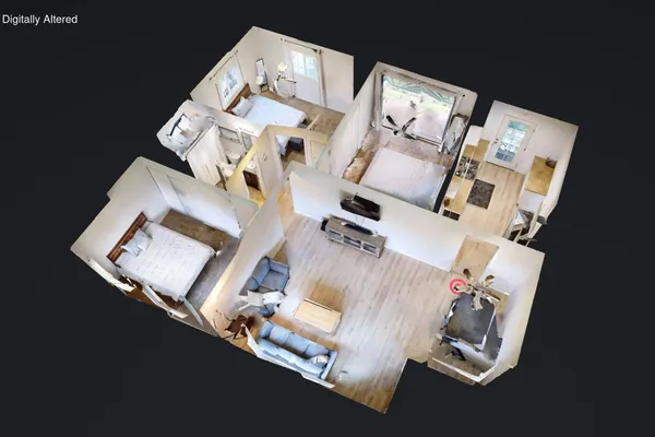 an aerial view of a house with a floor to ceiling fan and wooden floor