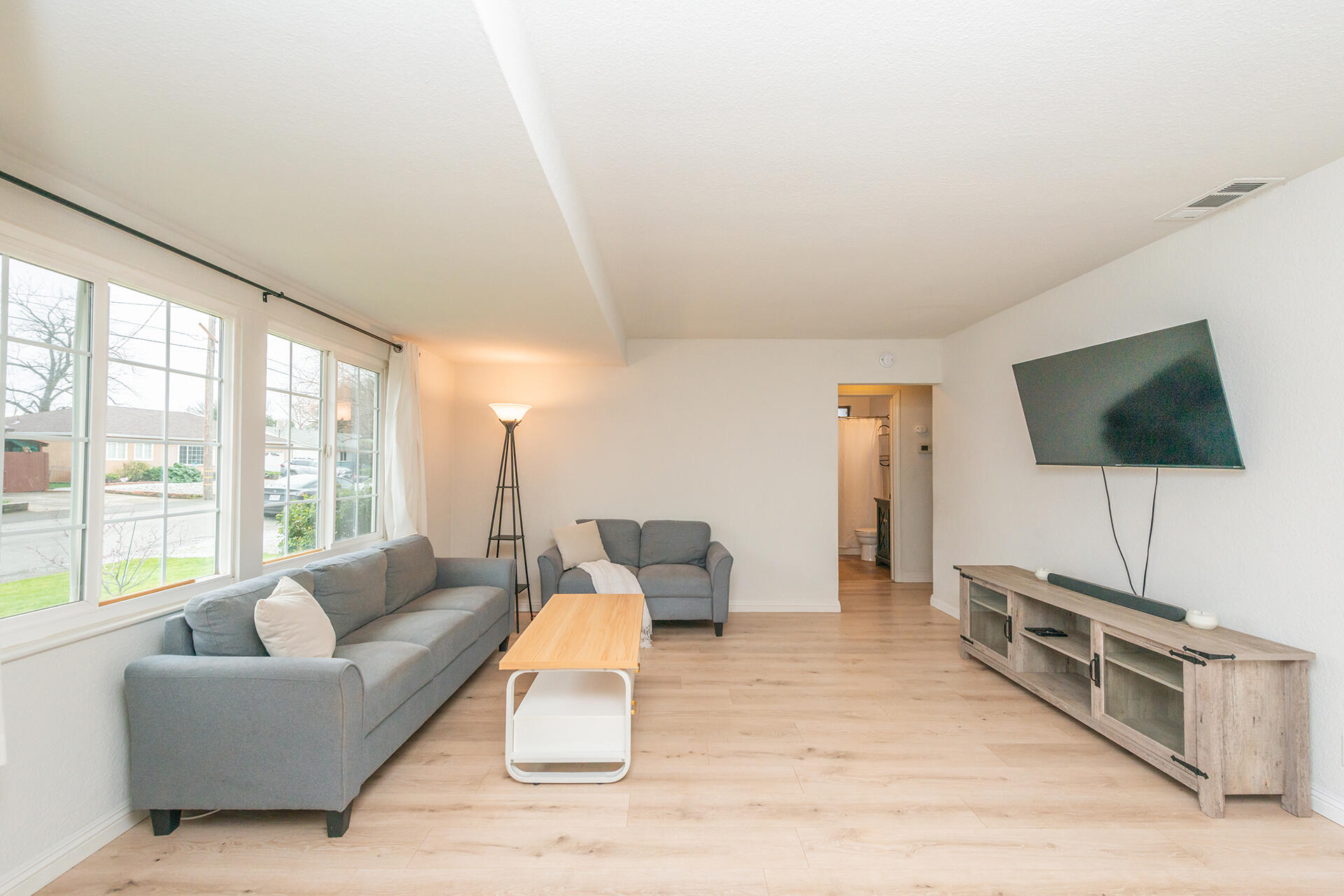1115 2nd Street Redding, CA 96002 - Photo 6 of 39 a living room with furniture and a flat screen tv