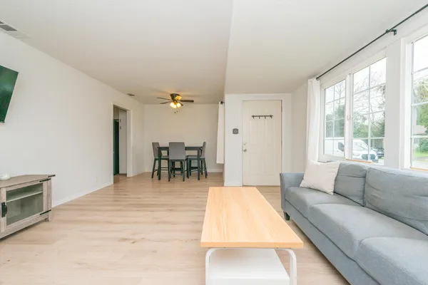 a living room with furniture and a large window