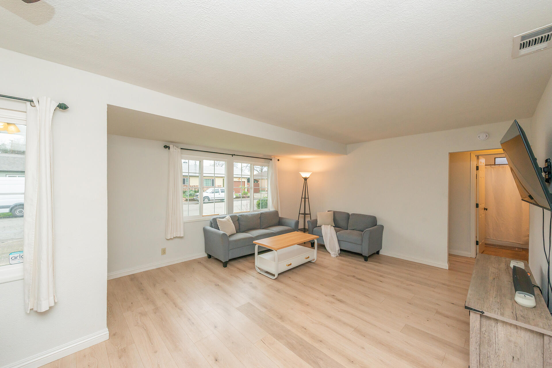 1115 2nd Street Redding, CA 96002 - Photo 8 of 39 a bedroom with furniture and a large window