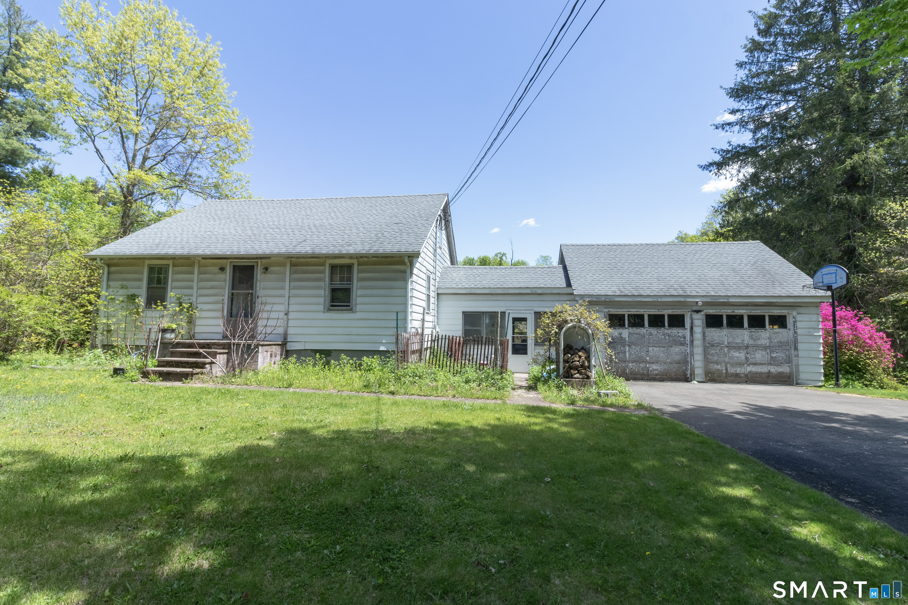 1973 Long Hill Road Guilford, CT 06437 - Photo 8 of 19 a backyard of a house with yard table and chairs
