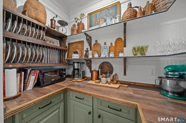 a kitchen with a refrigerator and a sink