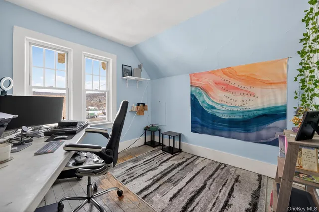 a workspace with furniture and a window