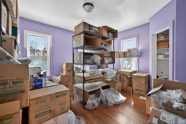 a room with furniture or couch and a wooden floor