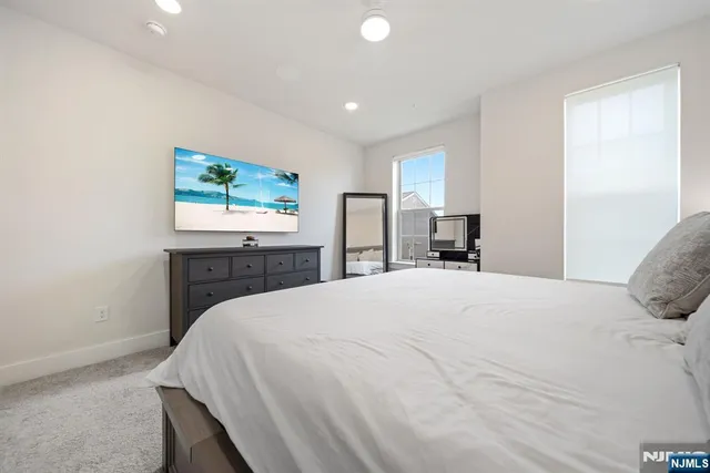 a view of walk in closet with clothes