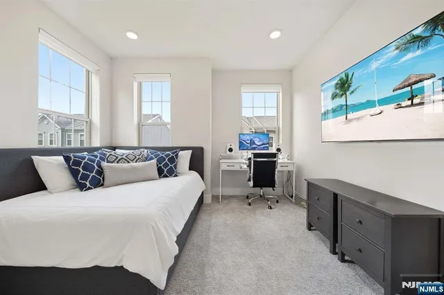 a bedroom with a bed and a chair