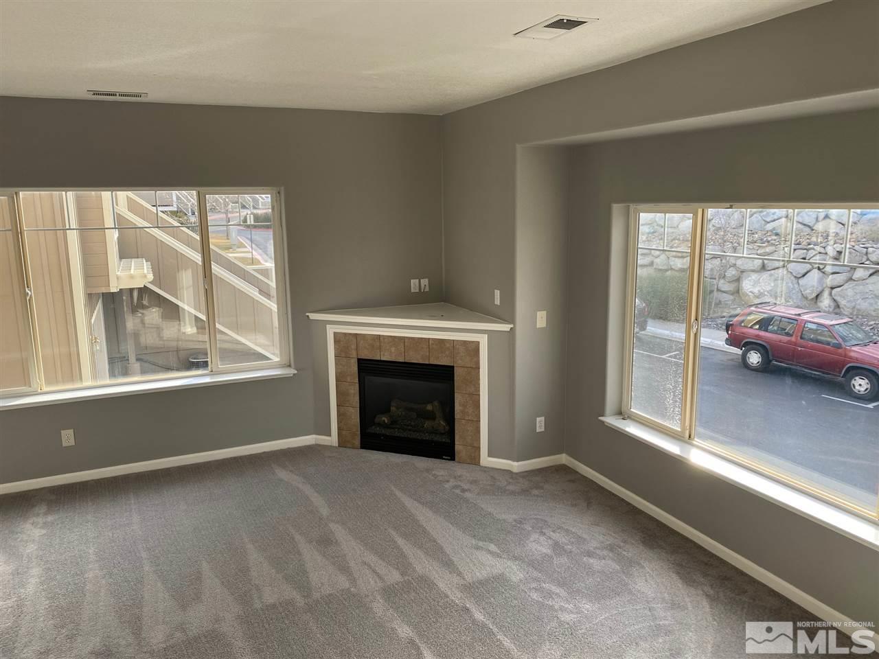 4150 Amber Marie Lane Reno, NV 89503 - Photo 3 of 16 a view of livingroom with window and fireplace
