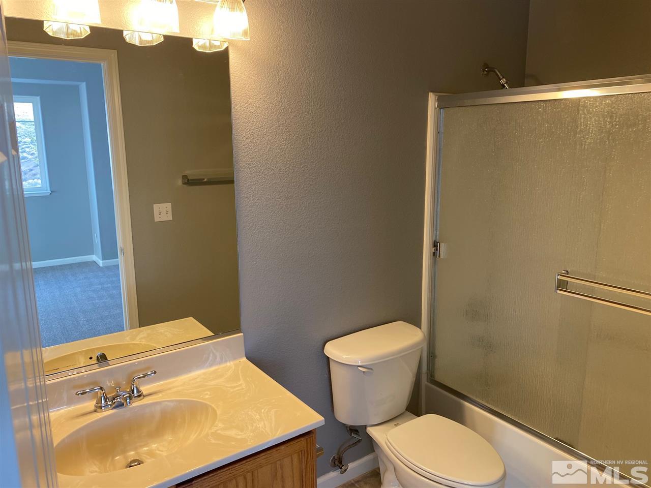 4150 Amber Marie Lane Reno, NV 89503 - Photo 8 of 16 a bathroom with a sink toilet and shower