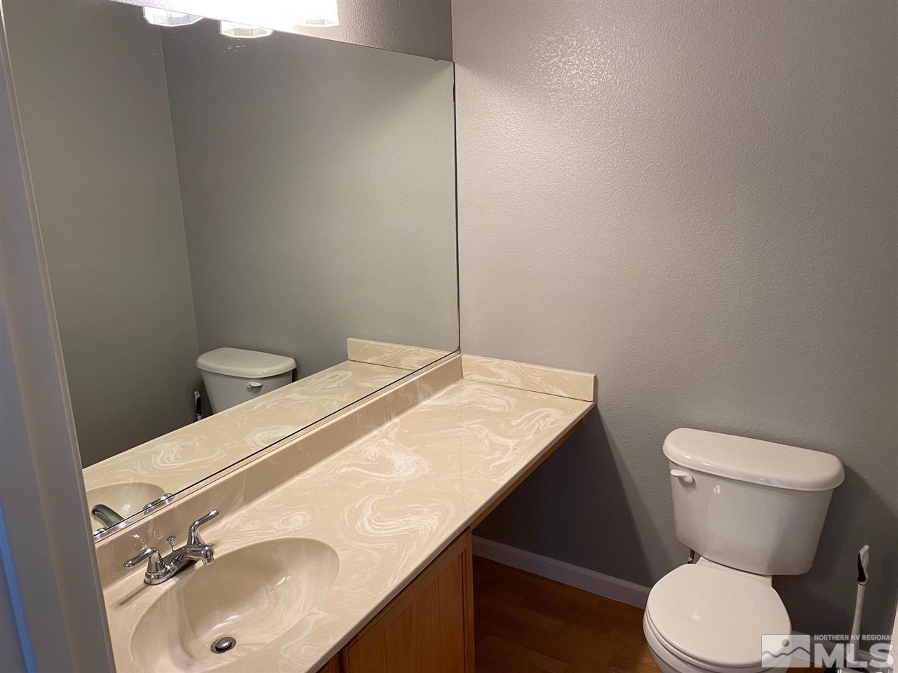 4150 Amber Marie Lane Reno, NV 89503 - Photo 10 of 16 a bathroom with a sink toilet and a mirror