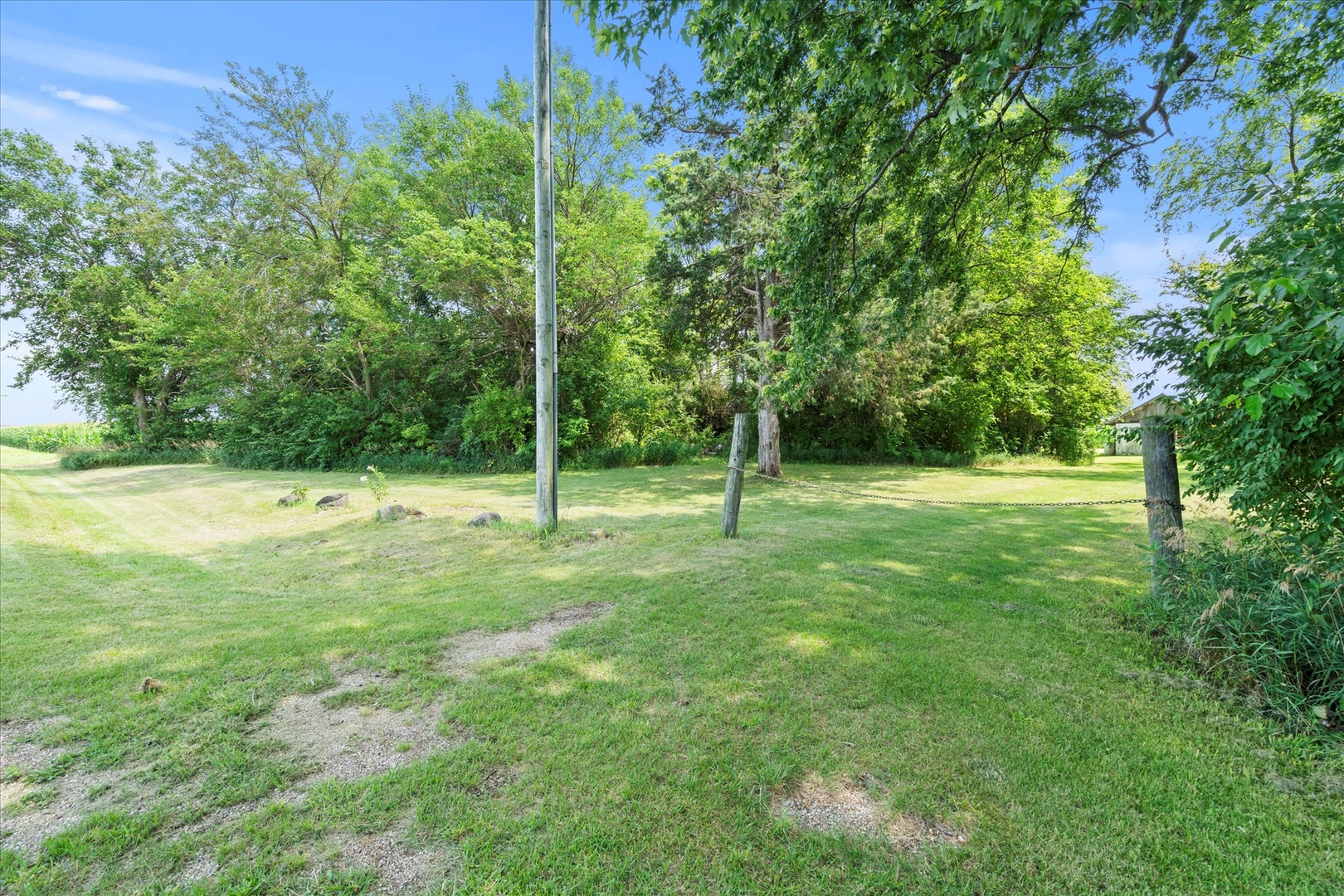 914 North 41st Road Mendota, IL 61342 - Photo 11 of 18 a view of outdoor space with a garden and trees