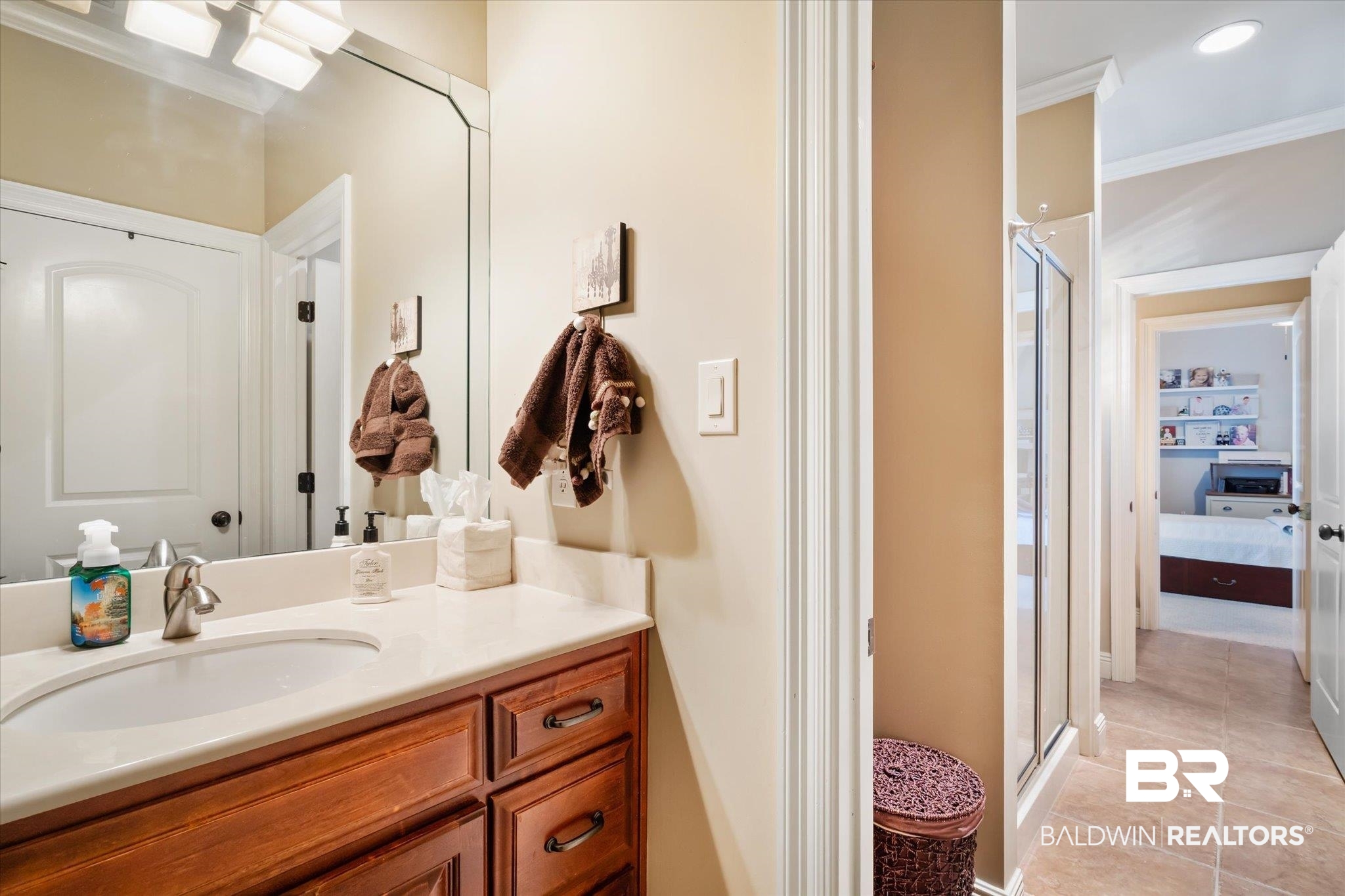 5683 Spring Landing Drive Theodore, AL 36582 - Photo 21 of 49 Bathroom with crown molding, vanity, an enclosed shower, and tile patterned flooring