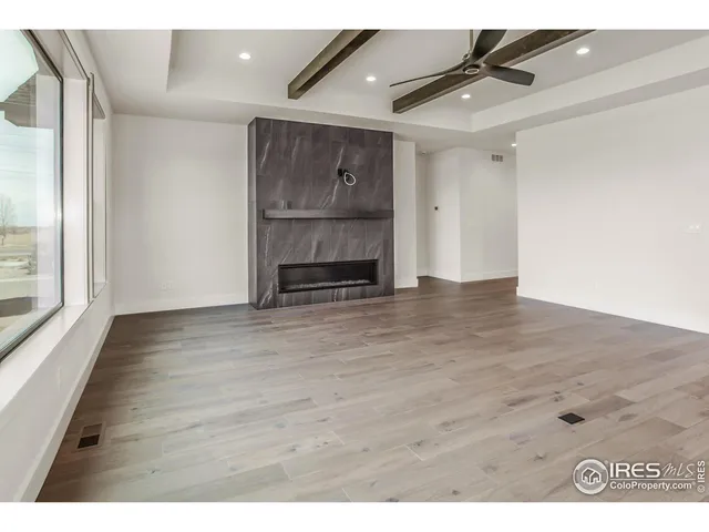a kitchen with kitchen island a counter top space a sink stainless steel appliances and cabinets