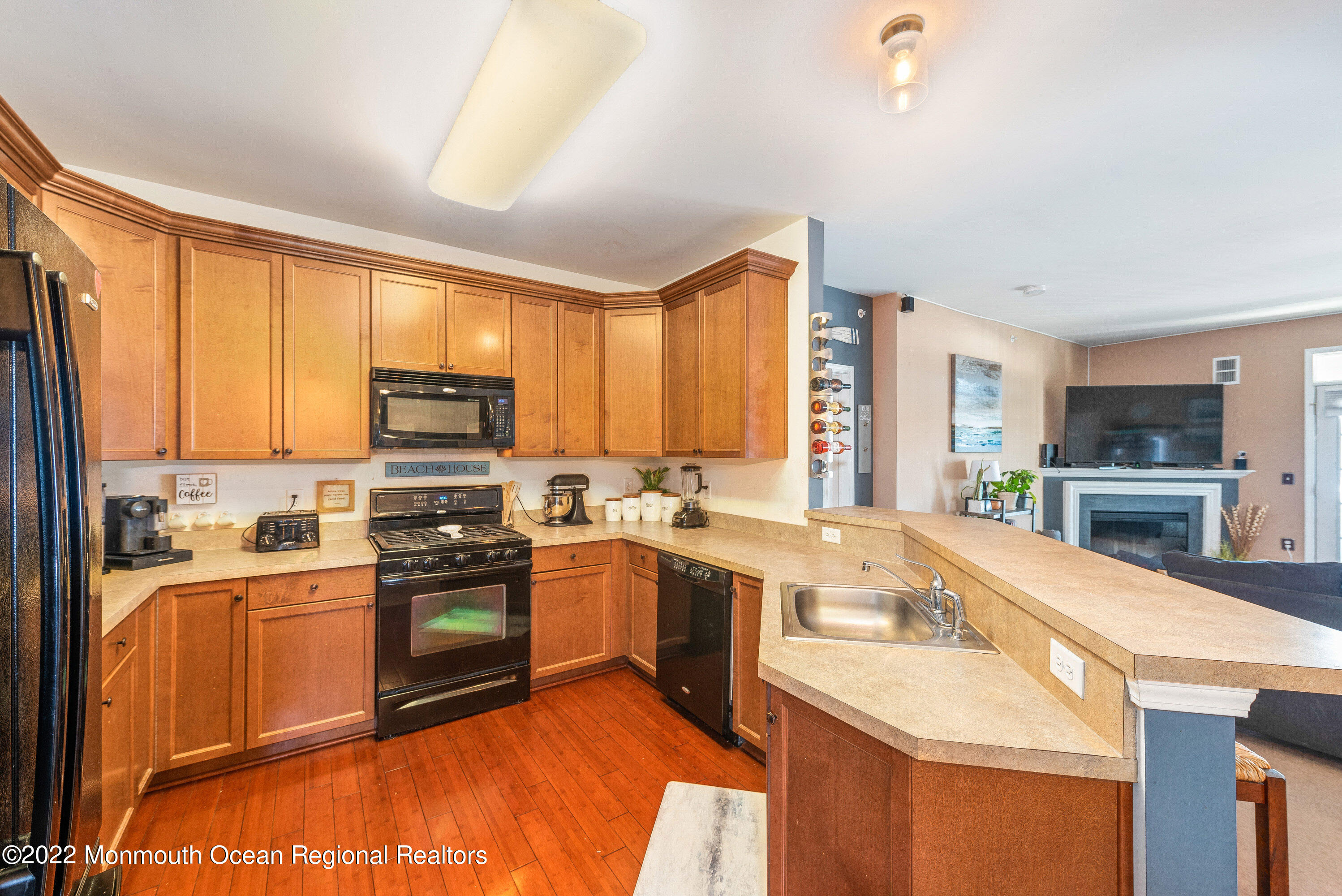 136 Mill Pond Way, Unit 22 Eatontown, NJ 07724 - Photo 15 of 29 a kitchen with stainless steel appliances a sink stove and refrigerator