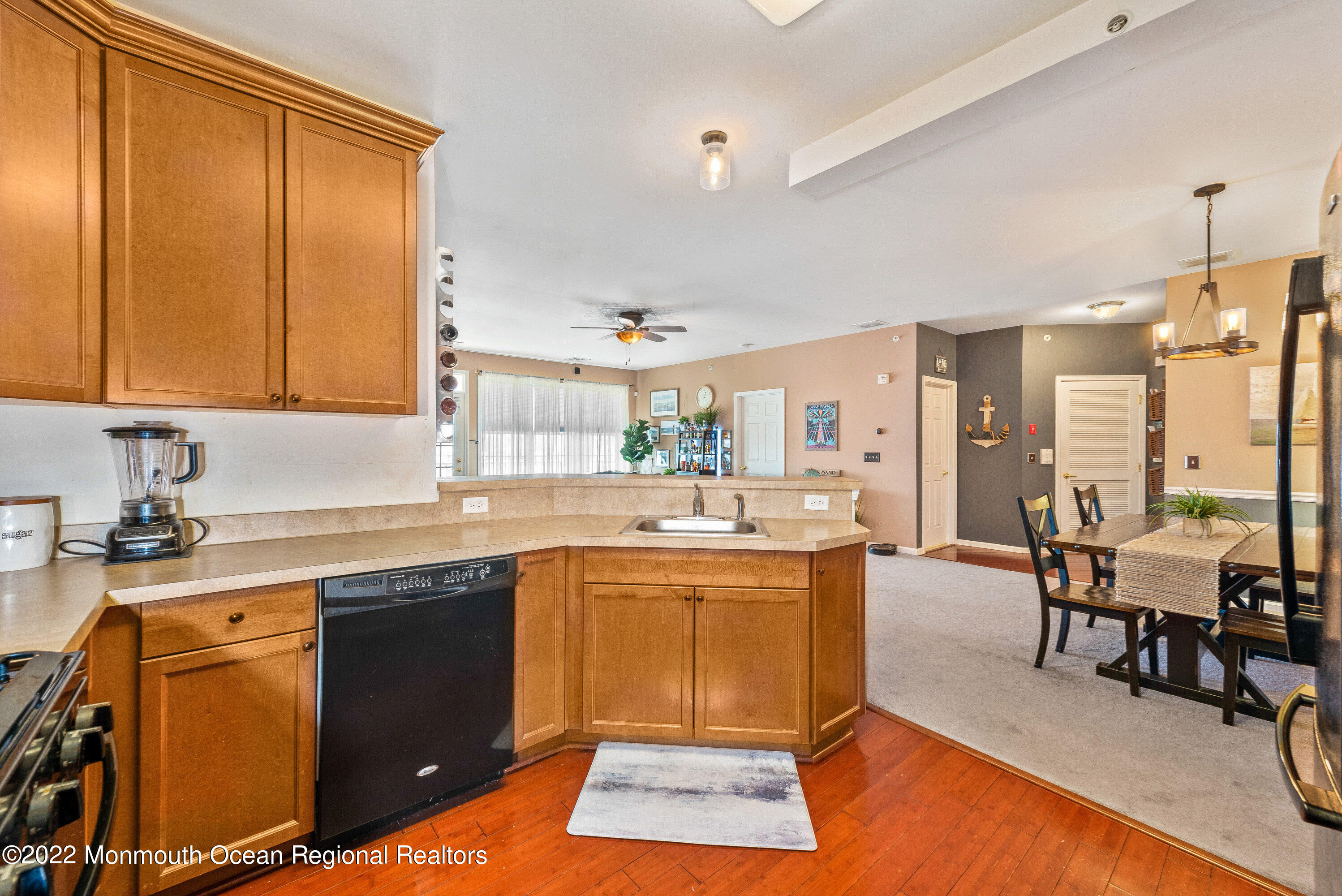 136 Mill Pond Way, Unit 22 Eatontown, NJ 07724 - Photo 17 of 29 a kitchen with a sink stove and cabinets