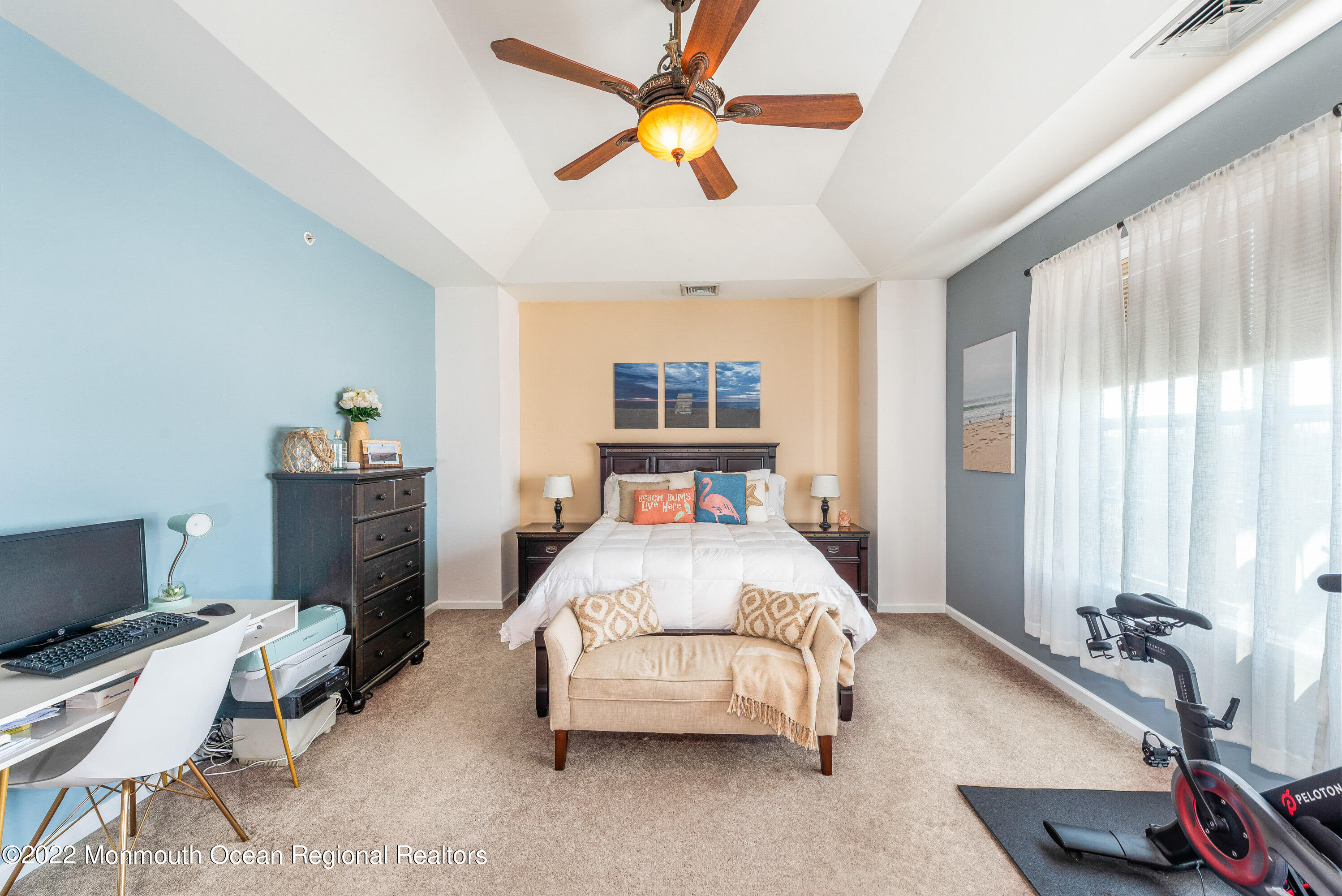 136 Mill Pond Way, Unit 22 Eatontown, NJ 07724 - Photo 19 of 29 a bedroom with a bed and a chandelier