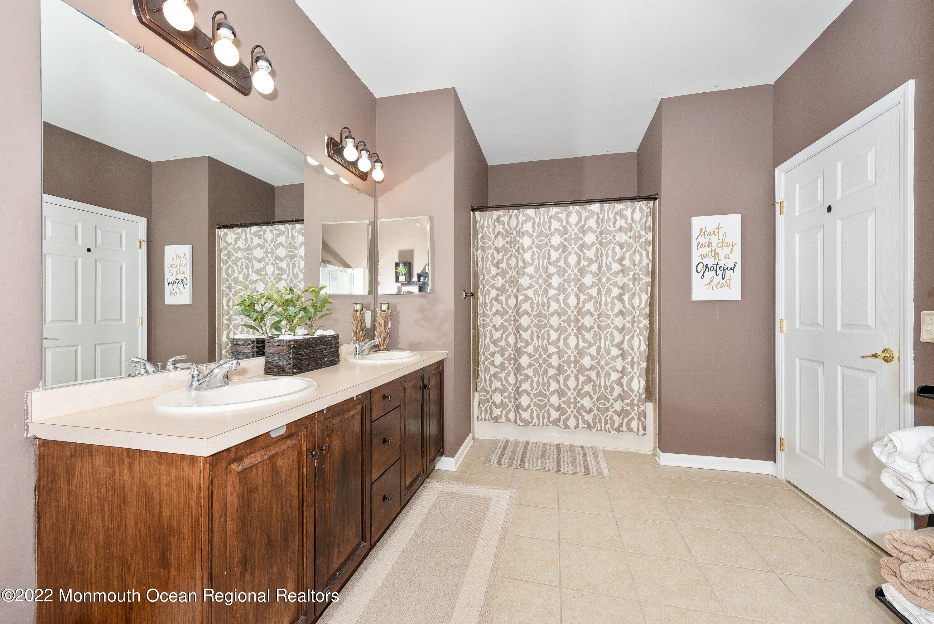136 Mill Pond Way, Unit 22 Eatontown, NJ 07724 - Photo 23 of 29 a bathroom with a double vanity sink mirror and shower