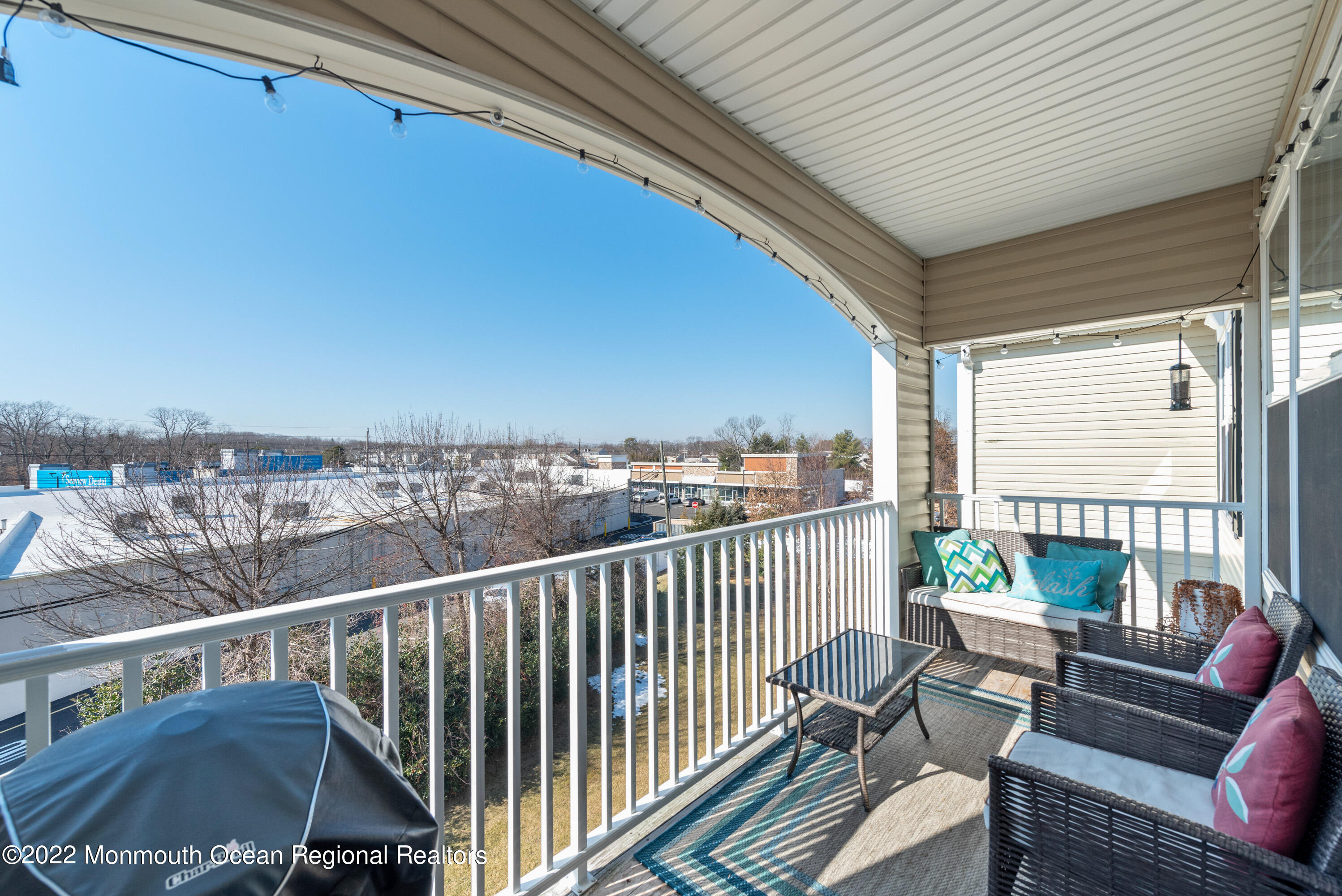 136 Mill Pond Way, Unit 22 Eatontown, NJ 07724 - Photo 27 of 29 a view of a balcony with furniture