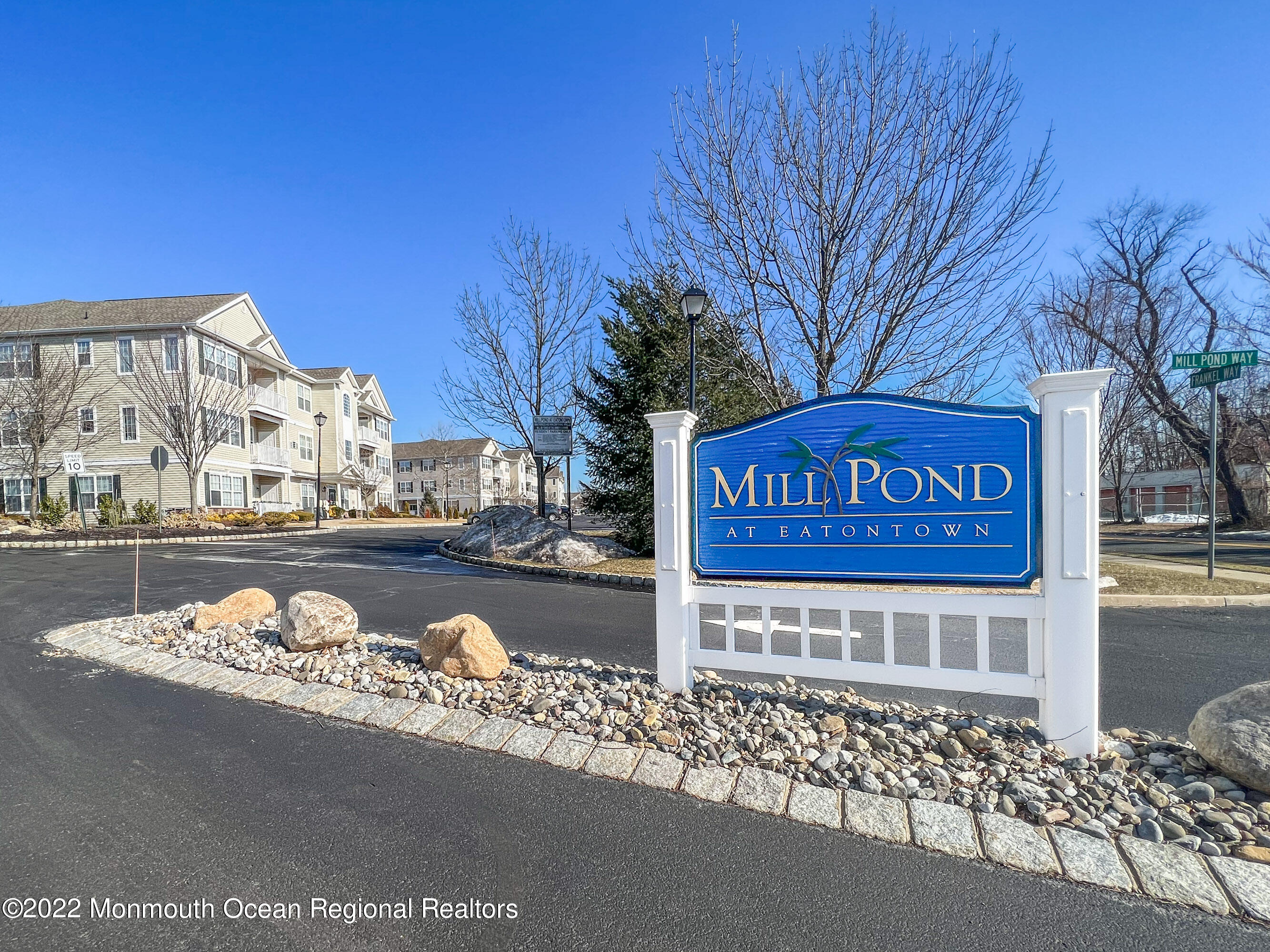 136 Mill Pond Way, Unit 22 Eatontown, NJ 07724 - Photo 29 of 29 a view of a street with red brick building