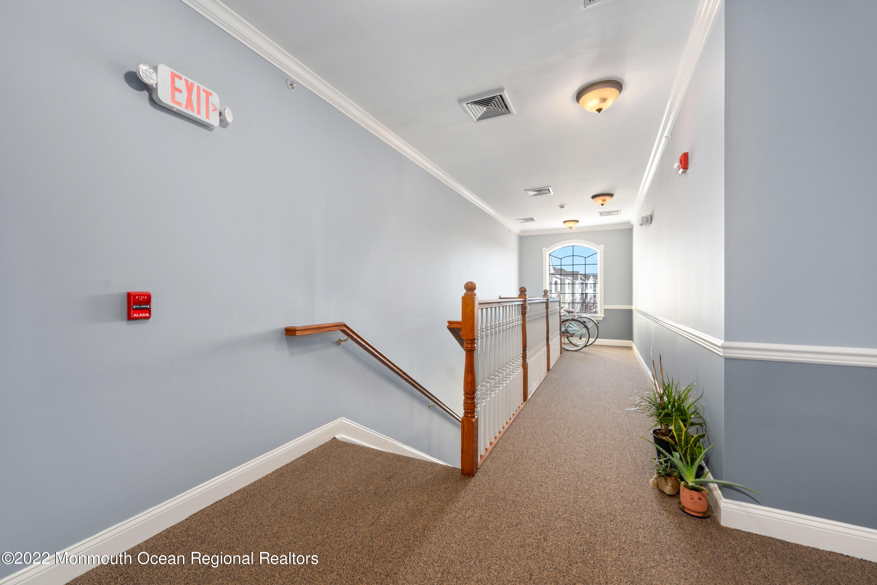 136 Mill Pond Way, Unit 22 Eatontown, NJ 07724 - Photo 4 of 29 a view of a hallway with stairs