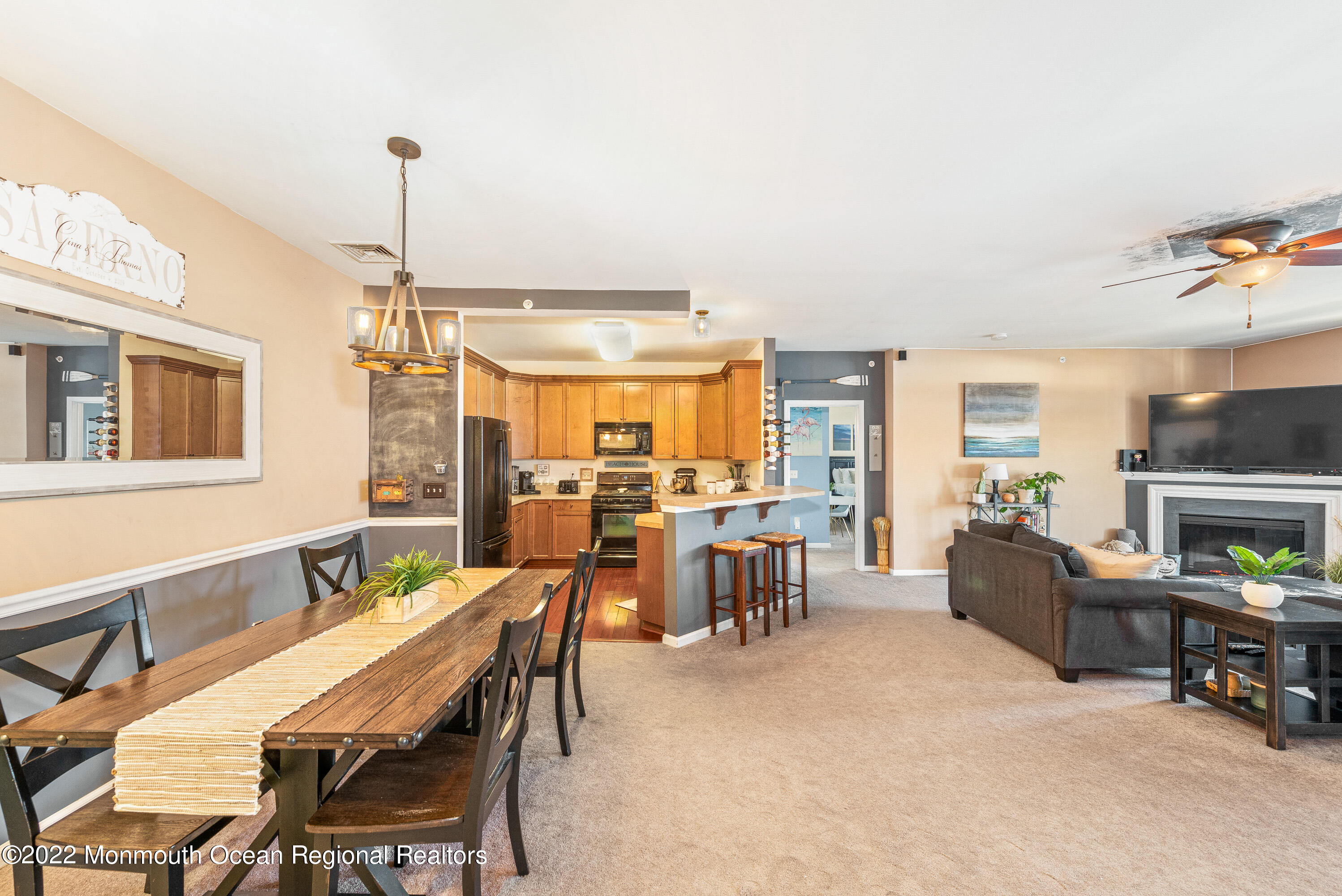 136 Mill Pond Way, Unit 22 Eatontown, NJ 07724 - Photo 6 of 29 a dining room with furniture and a floor to ceiling window