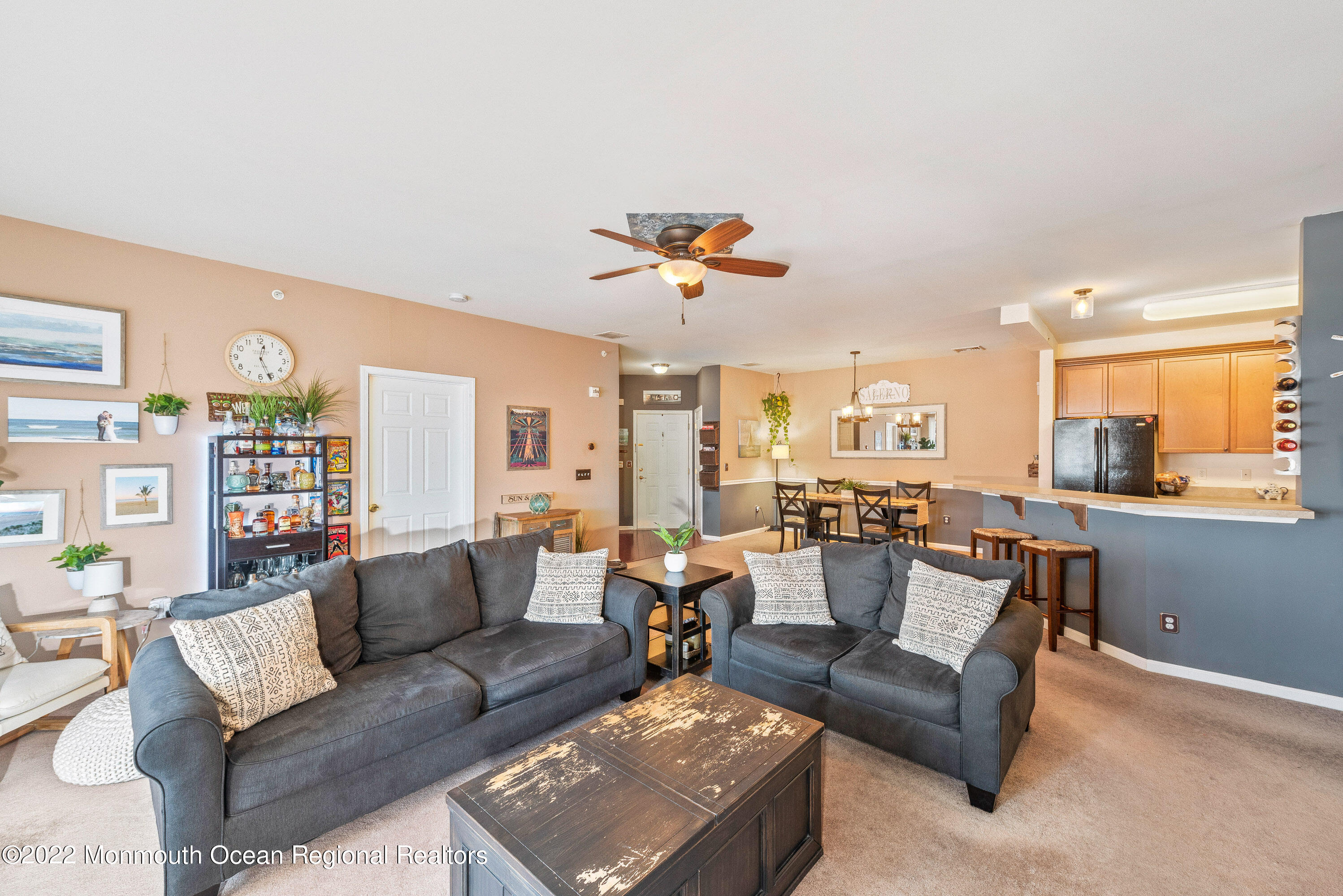 136 Mill Pond Way, Unit 22 Eatontown, NJ 07724 - Photo 10 of 29 a living room with furniture and a large window