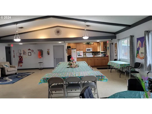 a living room with lots of furniture and clutter