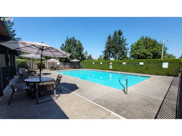 a balcony with table and chairs