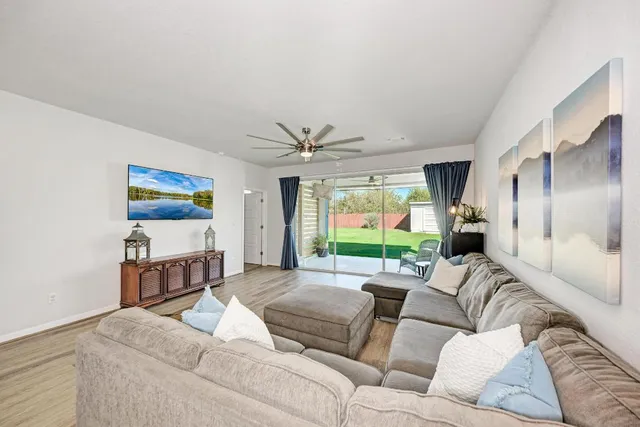 a bedroom with a bed a dresser and a large mirror