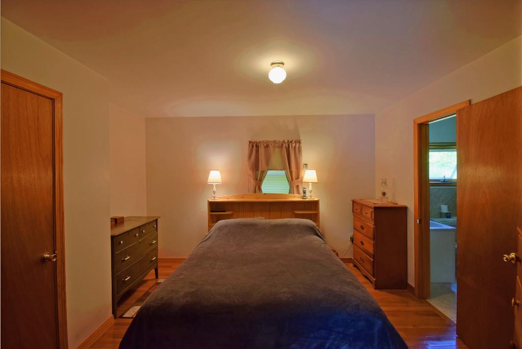 480 Bunker Hill Road Lagrange, ME 04453 - Photo 7 of 23 Master bedroom with private full bath