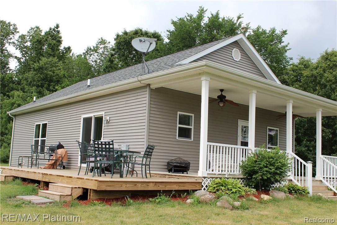 6691 Mabley Hill Road Fenton, MI 48430 - Photo 23 of 28 Entertain, and relax on large wrap deck